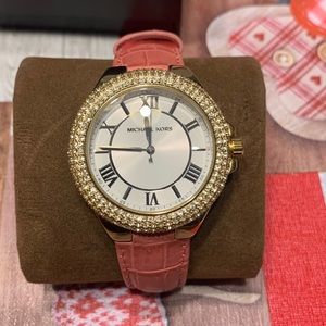 Pink leather Strap Michael Kors watch.